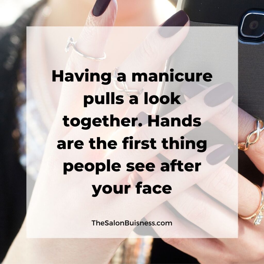 Inspiring manicure quotes - woman with fake nails holding phone.jpg