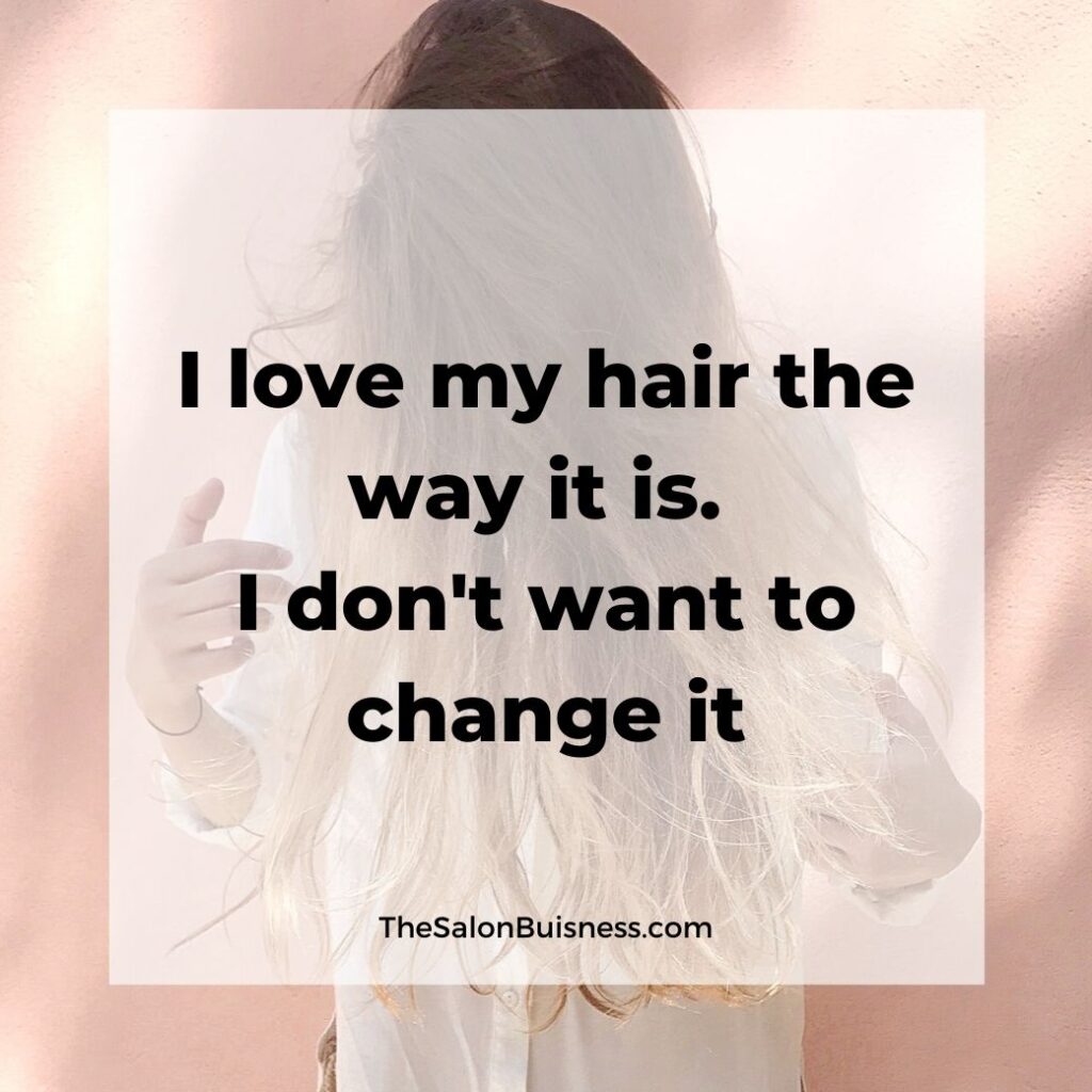 Positive Hair care quote - woman with brown & blond hair covering face pointing at hair - dressed in white shirt 