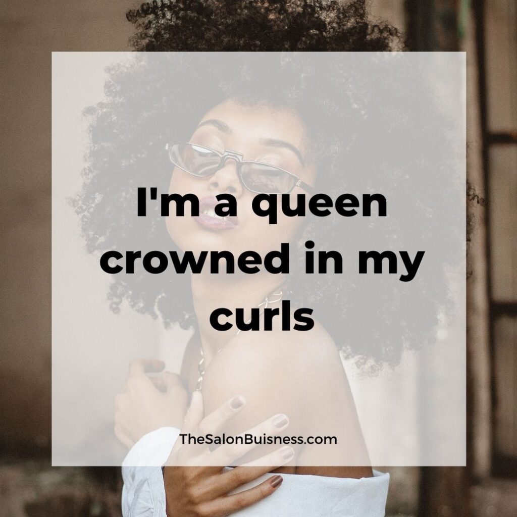 inspiring hair care quotes  - woman with black curly afro in white shirt and sunglasses